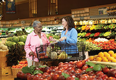 Senior and caregiver shopping