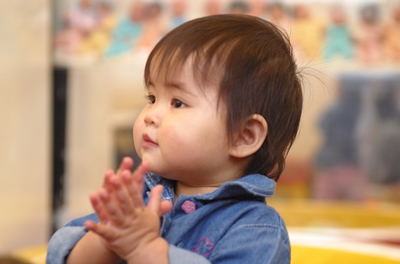 Asian Child clapping hands 