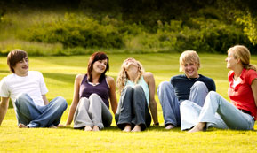 college kids sitting on lawn