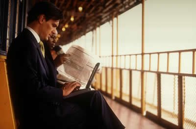 Laptop user & Newspaper Reader