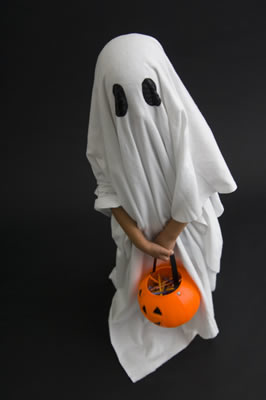 Child dressed as a ghost for Halloween